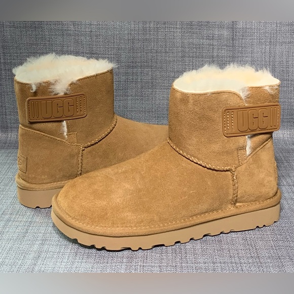 UGG Women's Mini Bailey Logo Strap Suede Boot Chesnut - Picture 2 of 8